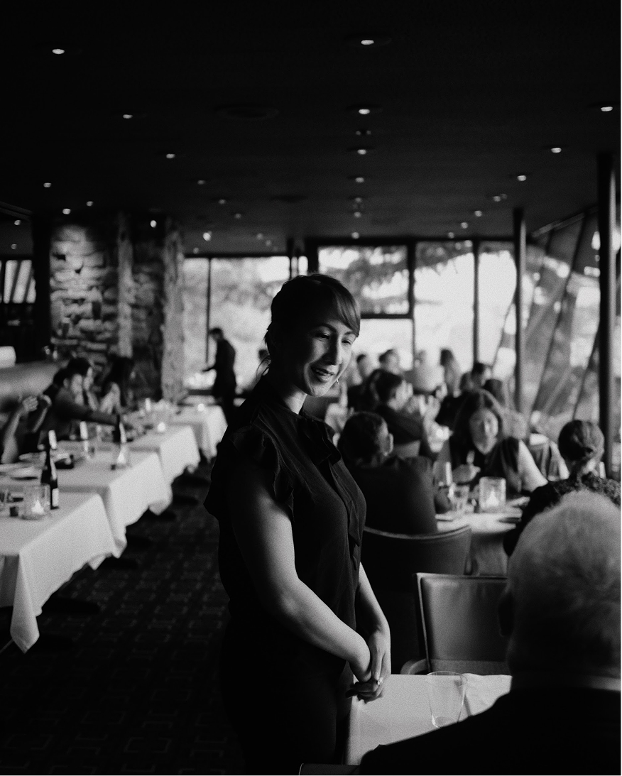 A Canlis server preparing a Canlis Salad tableside